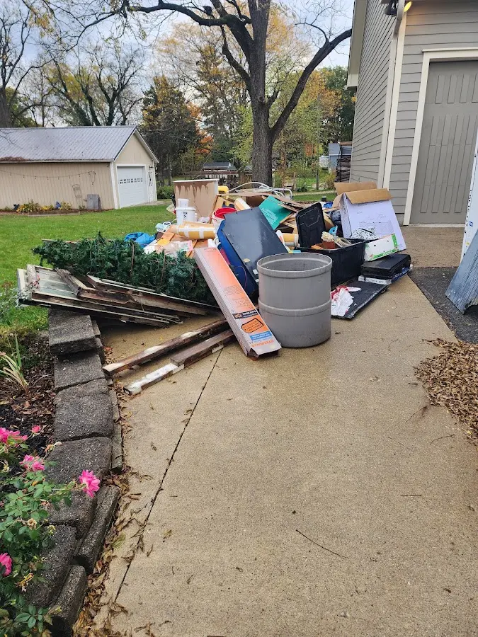 Dumpster being loaded with debris for Demolition Dumpster Rental in Wildewood